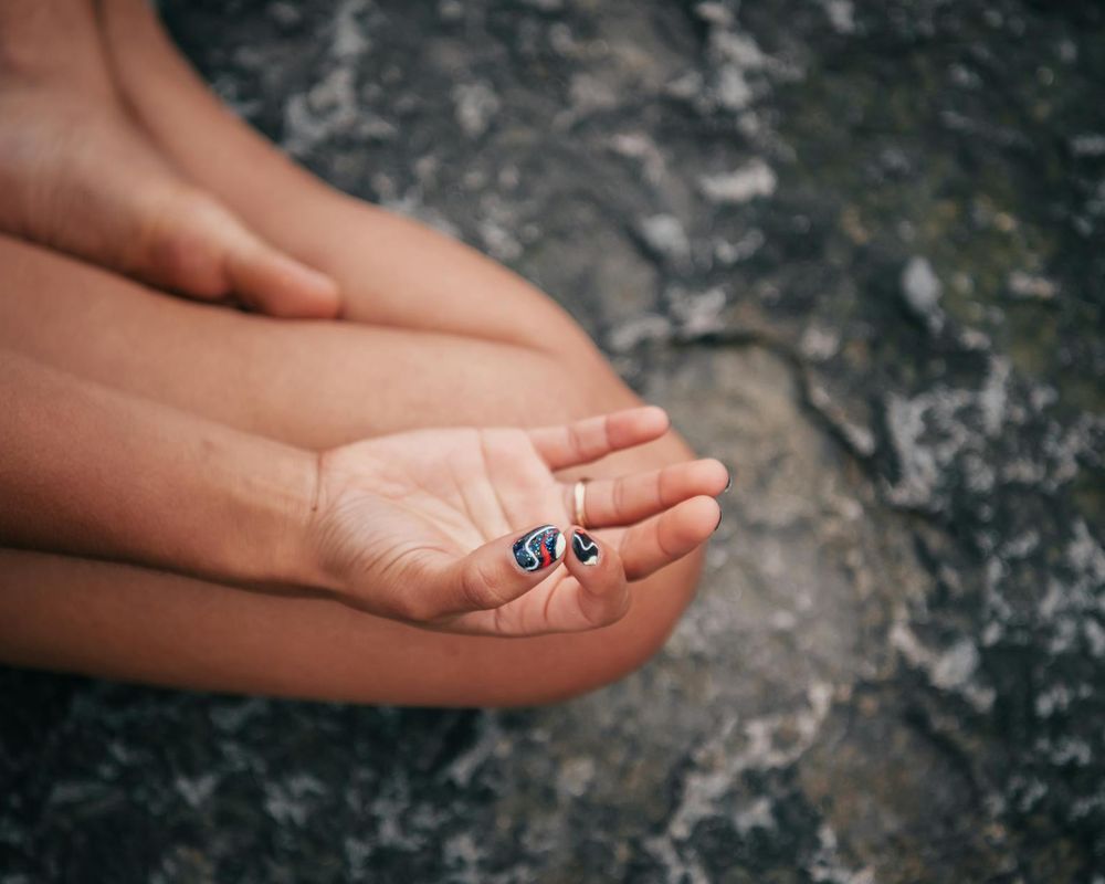 Close up of yoga practitioner hands in a grounding position